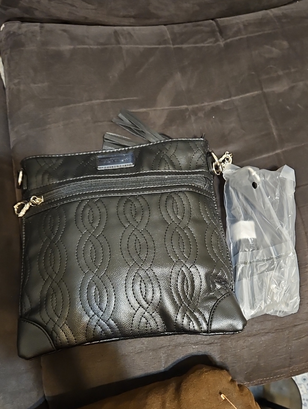 Quilted Black Crossbody Bag with Tassel Detail